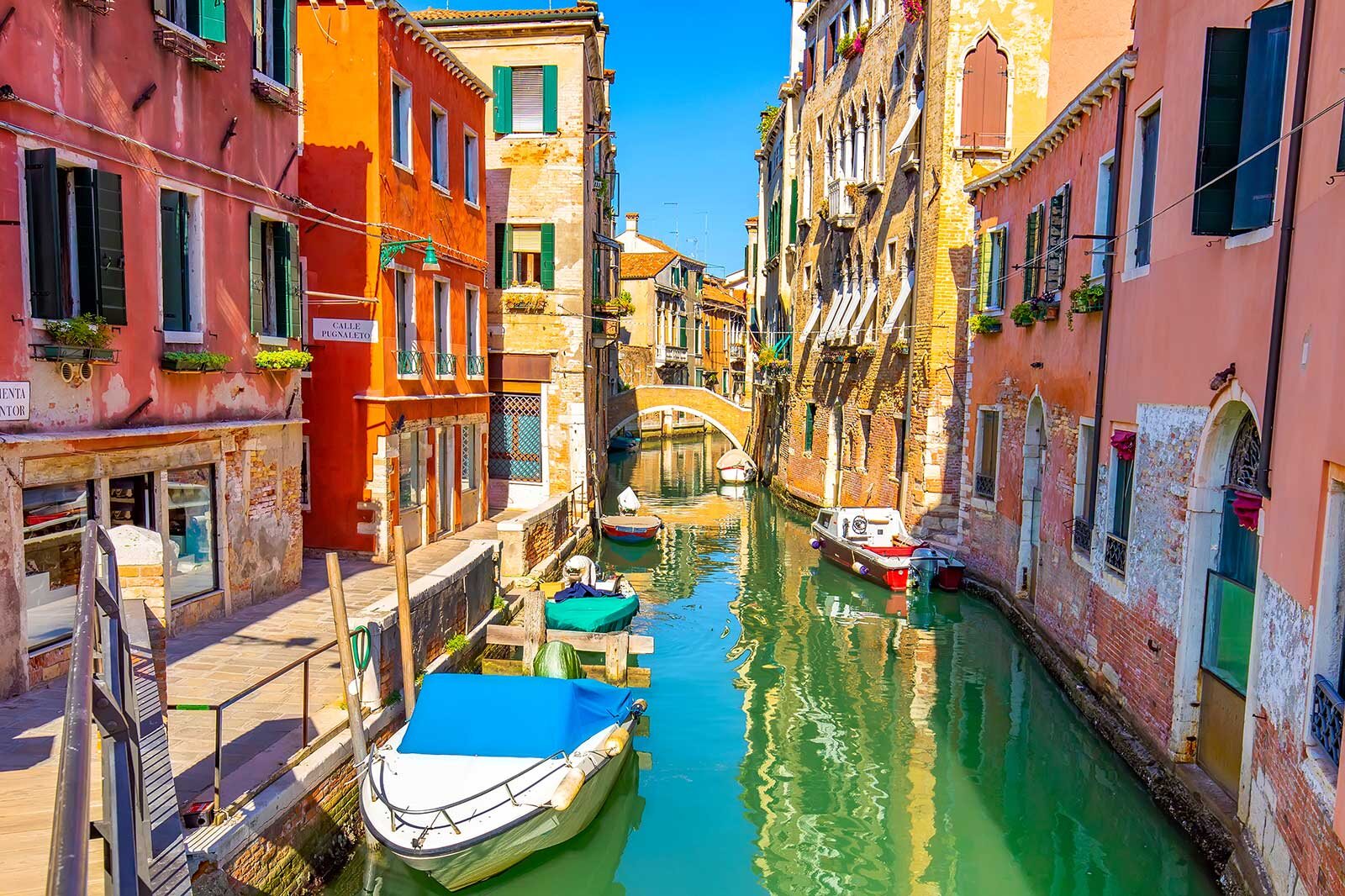 Colorful canal and boats in Venice