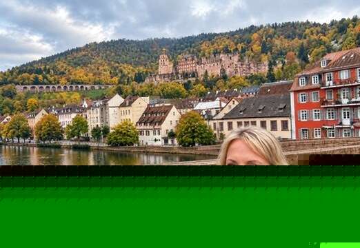 Megan beside the Neckar River with Heidelberg Castle in the background